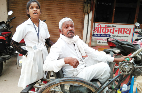 After school she takes her handicapped father to beg for alms