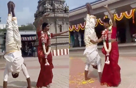 Bride dances as groom does handstand